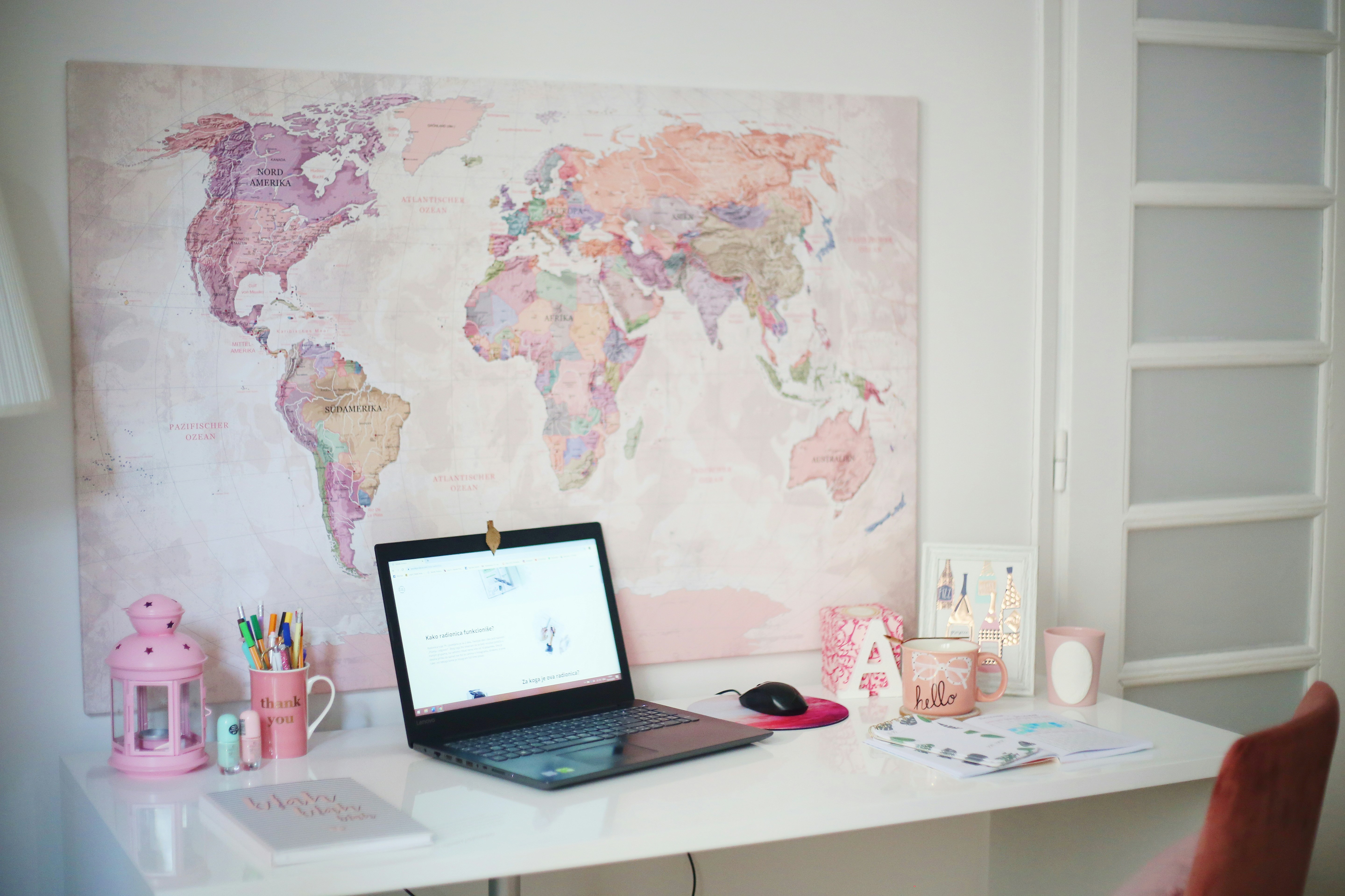 Modern home office with laptop and plant