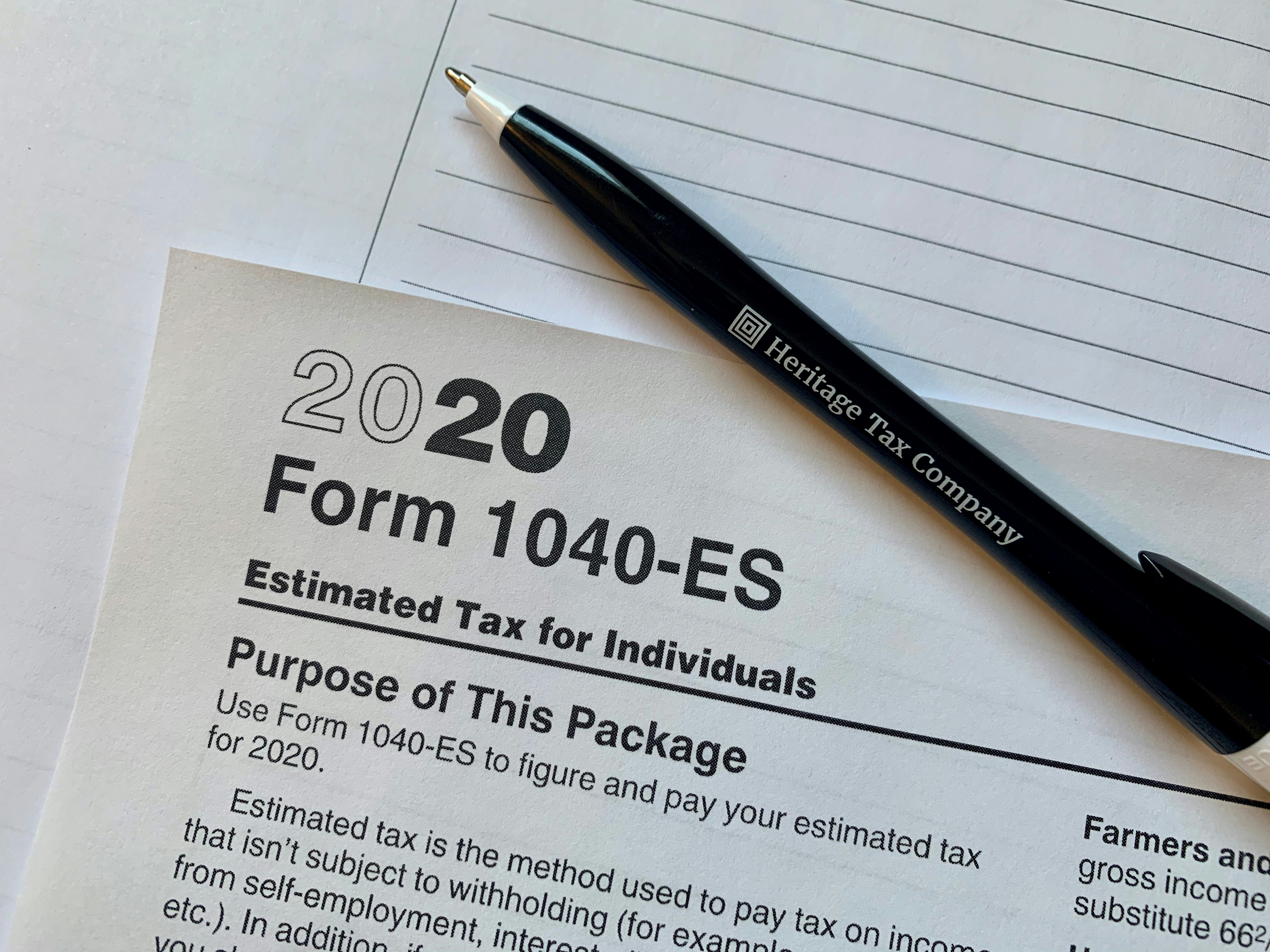 Tax forms and a laptop
