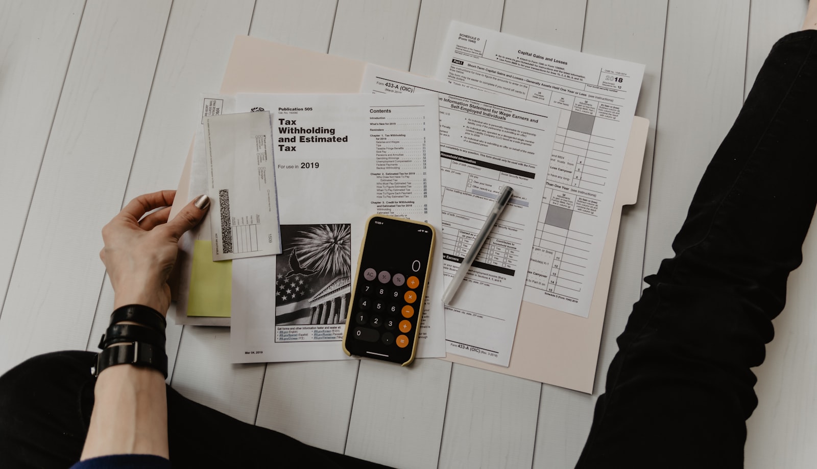 Travel agency owner reviewing commission reports, financial charts, and reconciled supplier statements on a bookkeeping dashboard